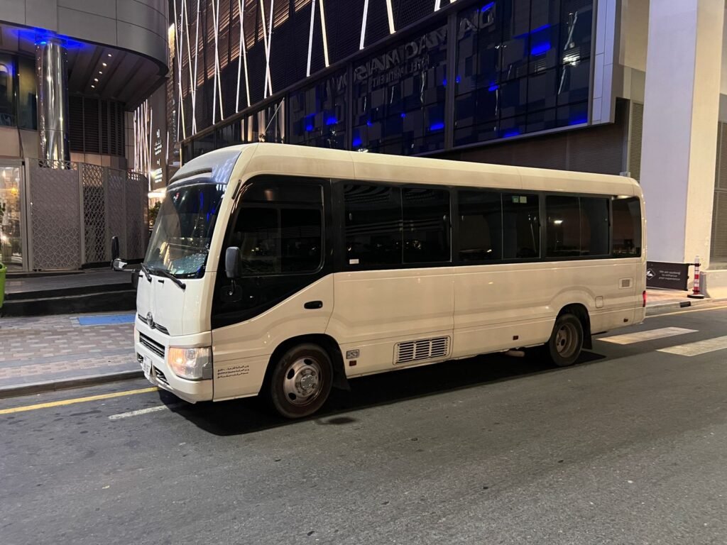 A 26-seater bus for rental in Dubai, offering spacious seating and a comfortable ride for small to medium-sized groups.