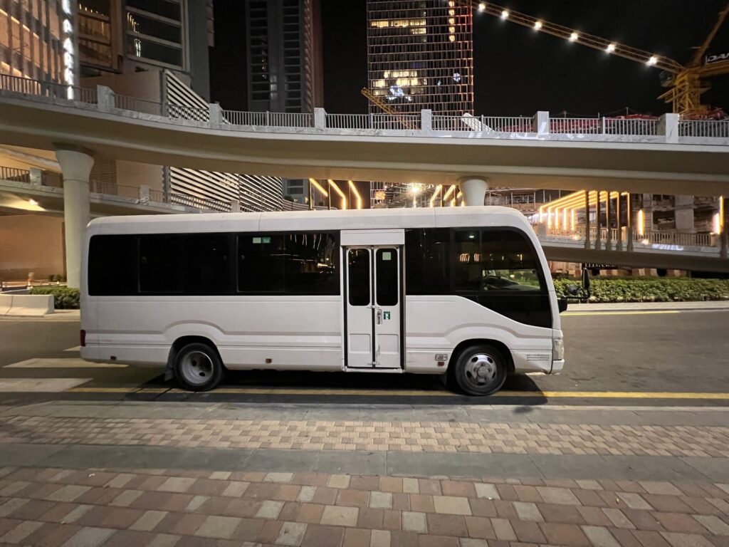 A Toyota Coaster available for rent in Dubai, suited for group transportation with modern features and a comfortable interior.